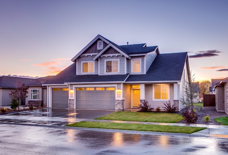 blue and gray concrete house with attic during twilight 186077 scaled